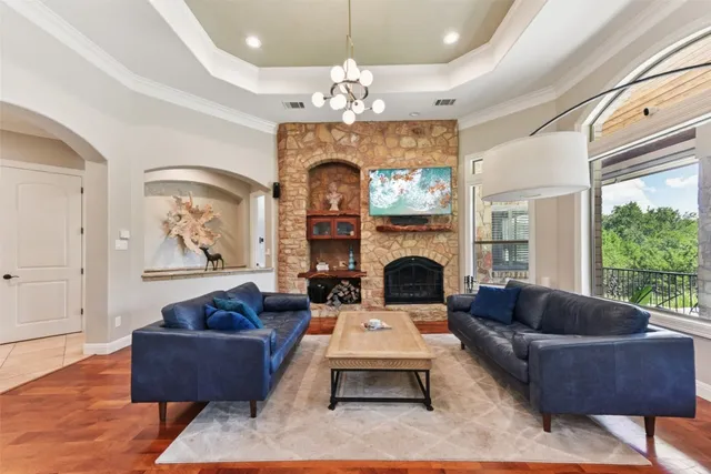 a view of a dining room with furniture and a chandelier