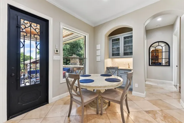 a kitchen with stainless steel appliances granite countertop a sink and a refrigerator