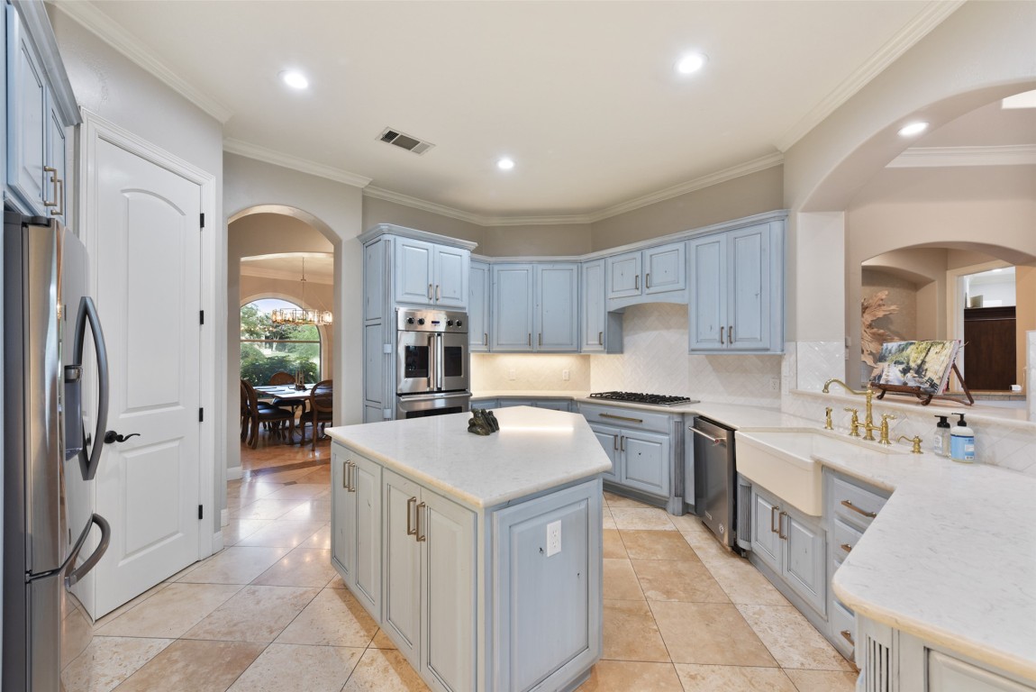 122 Silverstone Drive Georgetown, TX 78633 - Photo 20 of 40 a kitchen with a sink stove and refrigerator