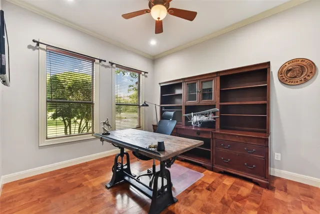 a bedroom with a bed table and a window