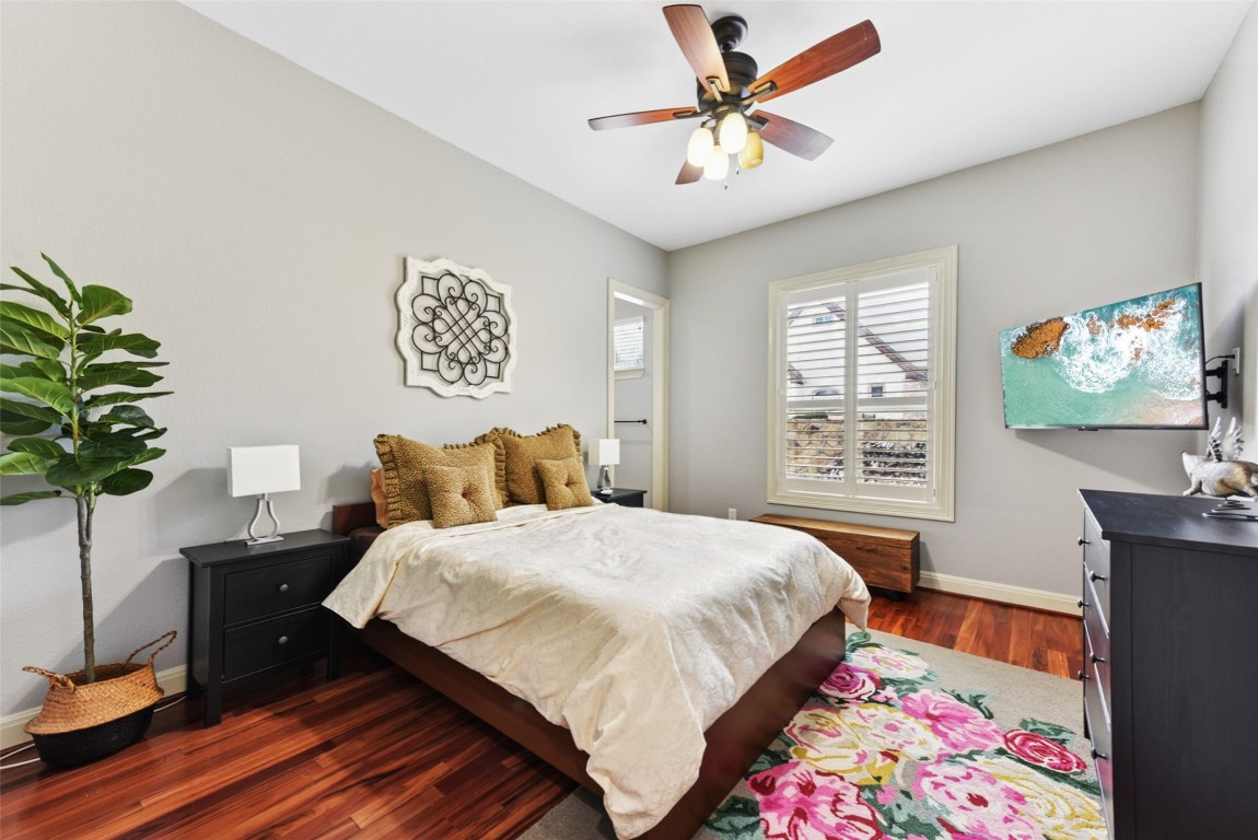 122 Silverstone Drive Georgetown, TX 78633 - Photo 26 of 40 a bedroom with a bed table and a window