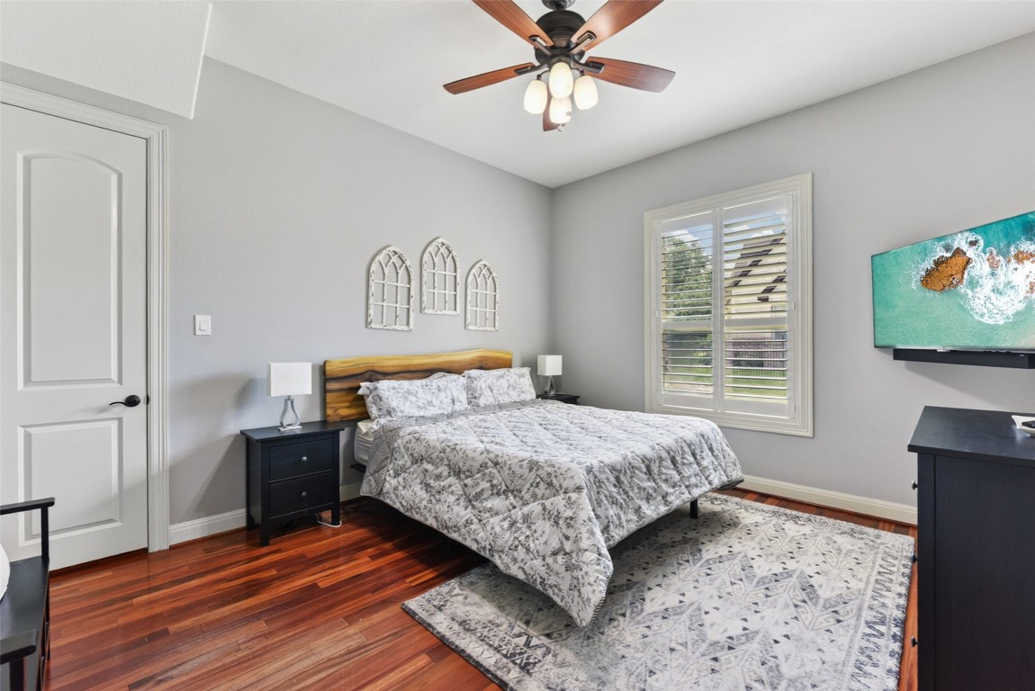 122 Silverstone Drive Georgetown, TX 78633 - Photo 28 of 40 a bedroom with a bed and a flat screen tv