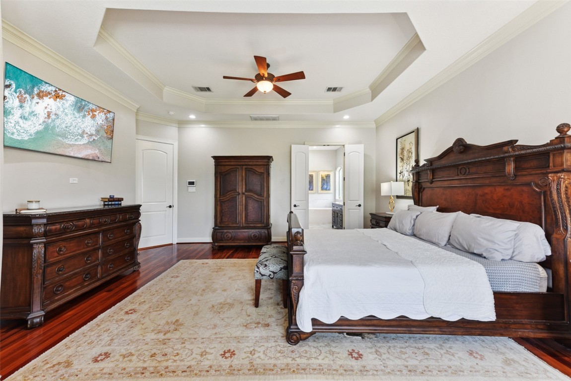 122 Silverstone Drive Georgetown, TX 78633 - Photo 32 of 40 a bedroom with a bed and a dresser