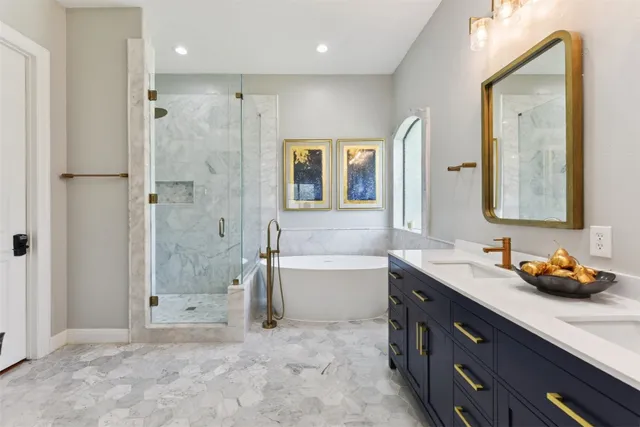 a bathroom with a bathtub and shower