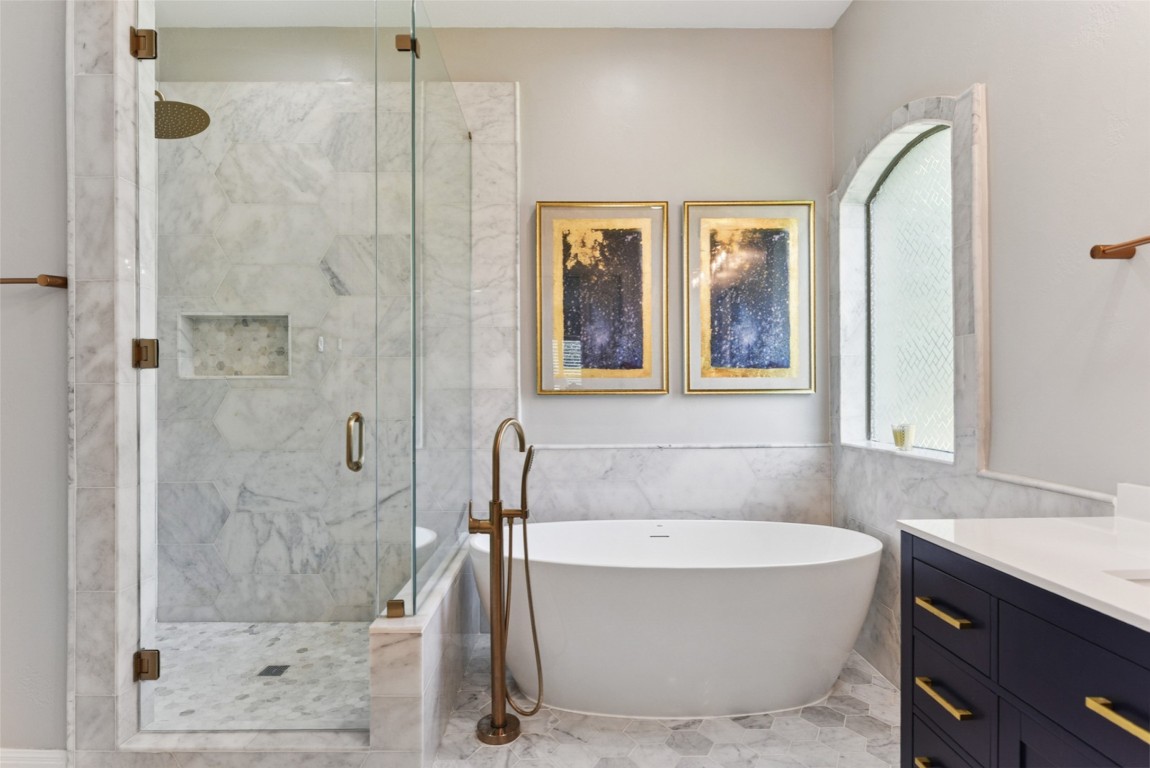 122 Silverstone Drive Georgetown, TX 78633 - Photo 34 of 40 a bathroom with a bathtub and shower