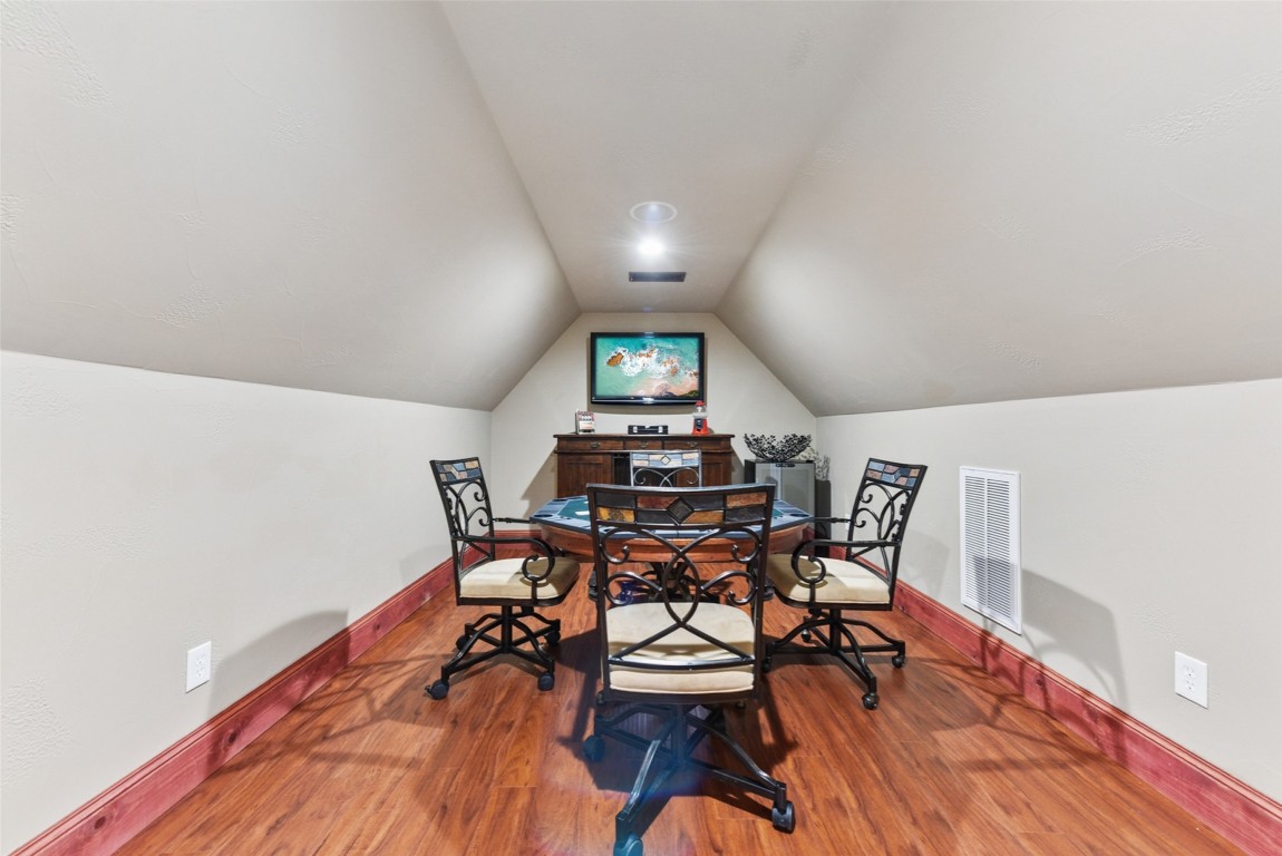 122 Silverstone Drive Georgetown, TX 78633 - Photo 36 of 40 a view of a dining room with furniture and wooden floor