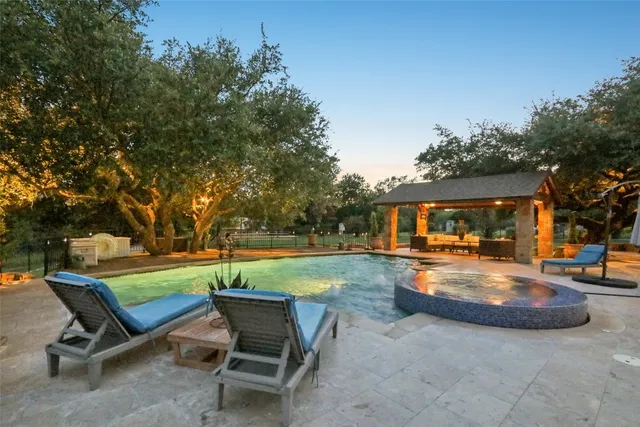 a view of a backyard with sitting area