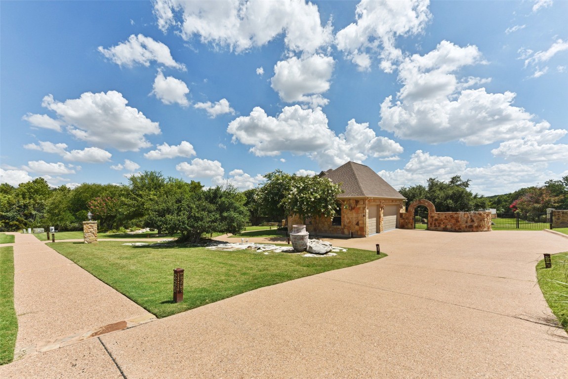122 Silverstone Drive Georgetown, TX 78633 - Photo 9 of 40 a view of a garden with lawn chairs