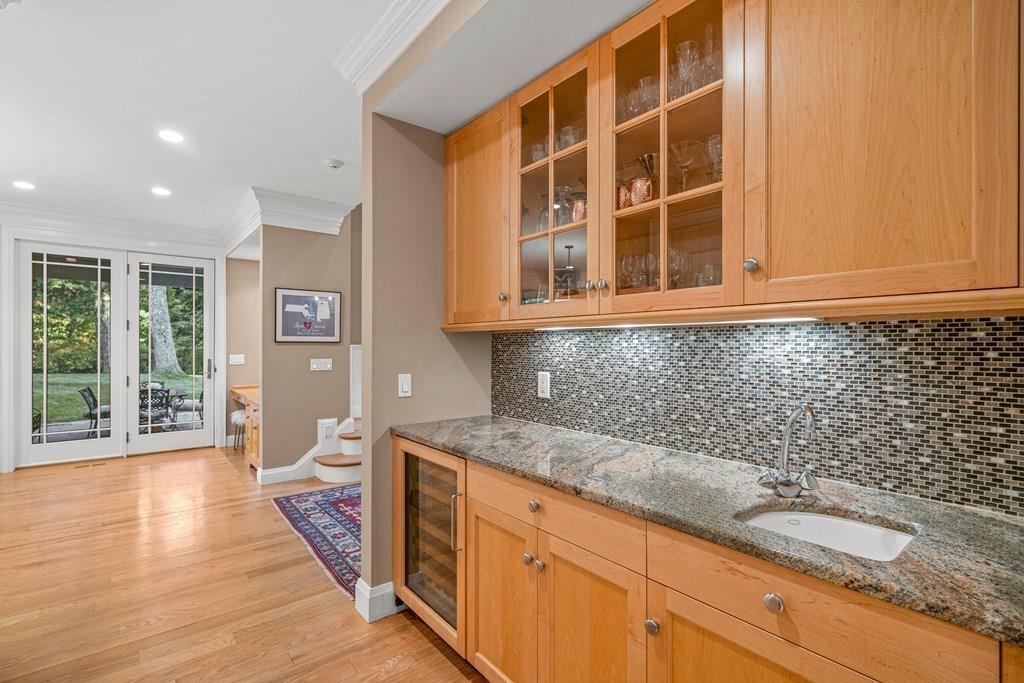 150 Wellesley Street Weston, MA 02493 - Photo 11 of 31 a kitchen with granite countertop sink and cabinets