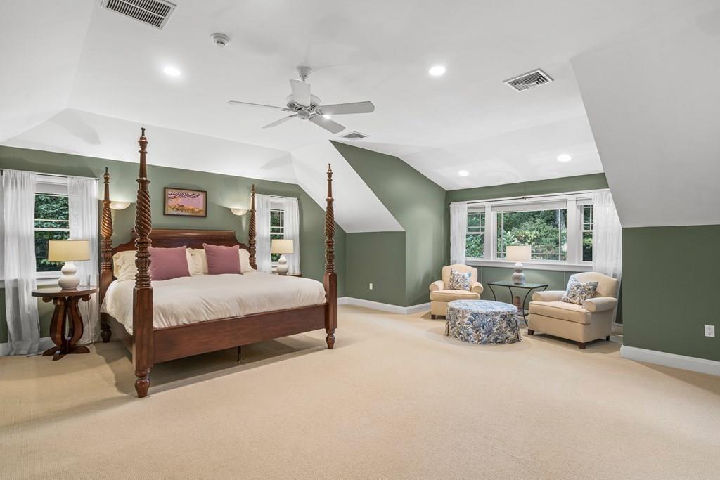 150 Wellesley Street Weston, MA 02493 - Photo 17 of 31 a spacious bedroom with a bed couch and window