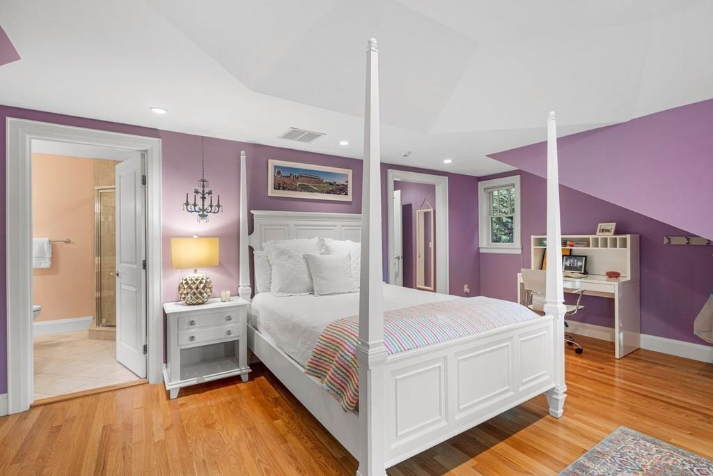 150 Wellesley Street Weston, MA 02493 - Photo 19 of 31 a bedroom with a bed and a view of bathroom