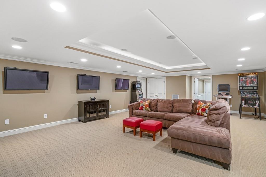 150 Wellesley Street Weston, MA 02493 - Photo 24 of 31 a living room with furniture and a fireplace
