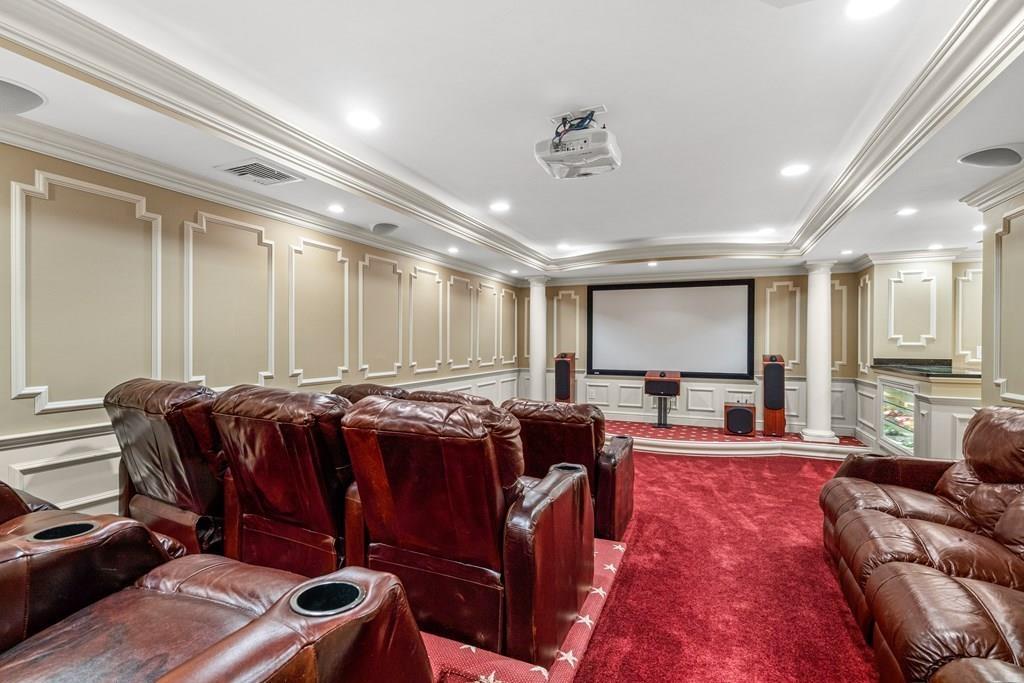 150 Wellesley Street Weston, MA 02493 - Photo 25 of 31 a living room with furniture a flat screen tv and a large window