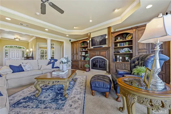a spacious bathroom with a granite countertop sink a large mirror and a bathtub next to a window