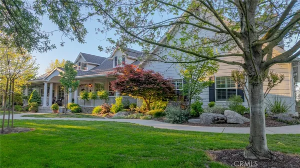 an aerial view of house with yard