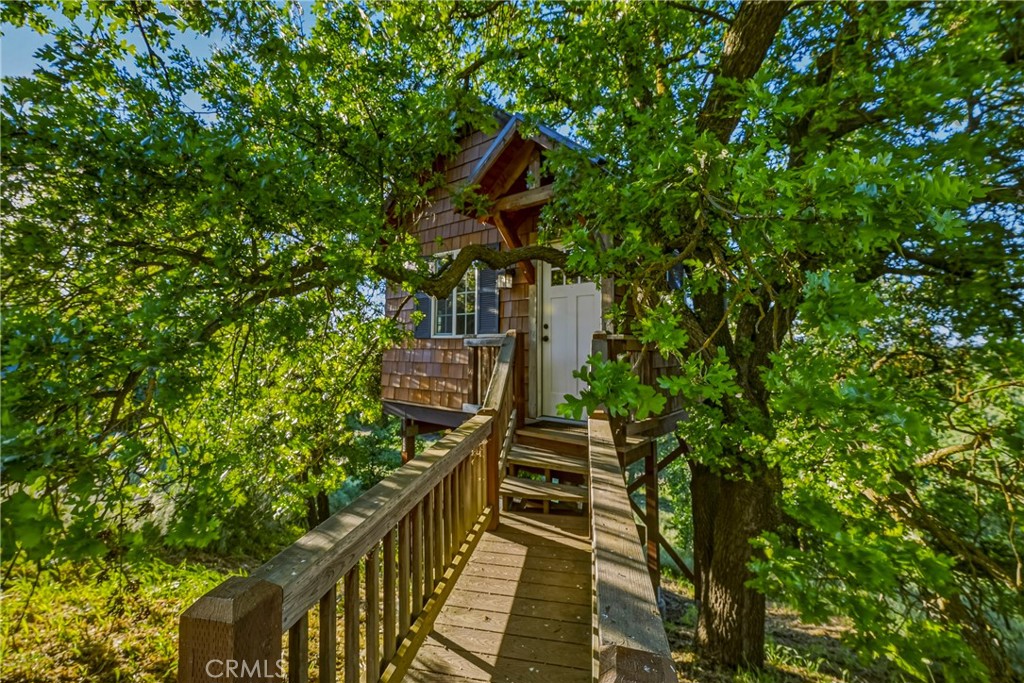 11126 Livingston Cressey Road Livingston, CA 95334 - Photo 56 of 75 Walkway out to the storybook treehouse perched between Valley Oaks