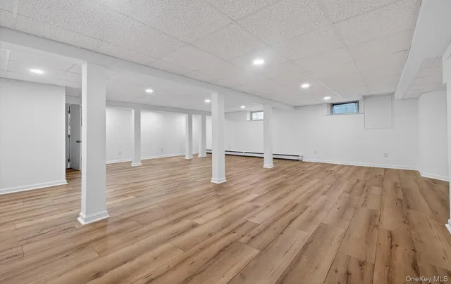 a view of empty room with wooden ceiling