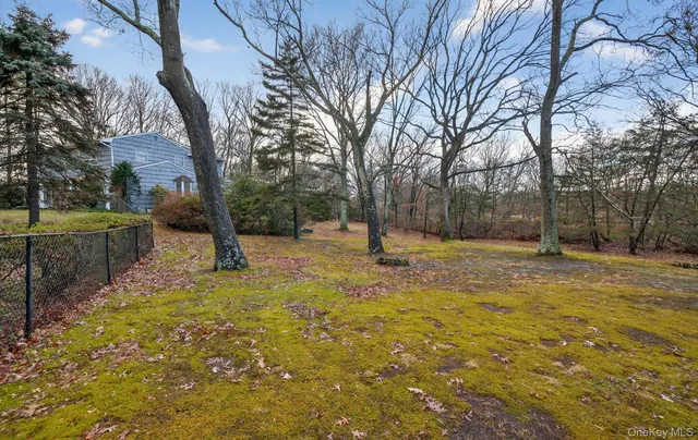 a view of road with parked cars