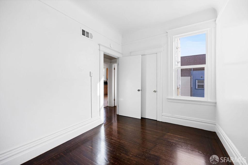 2401 23rd Street San Francisco, CA 94110 - Photo 46 of 76 a view of an empty room with wooden floor and closet