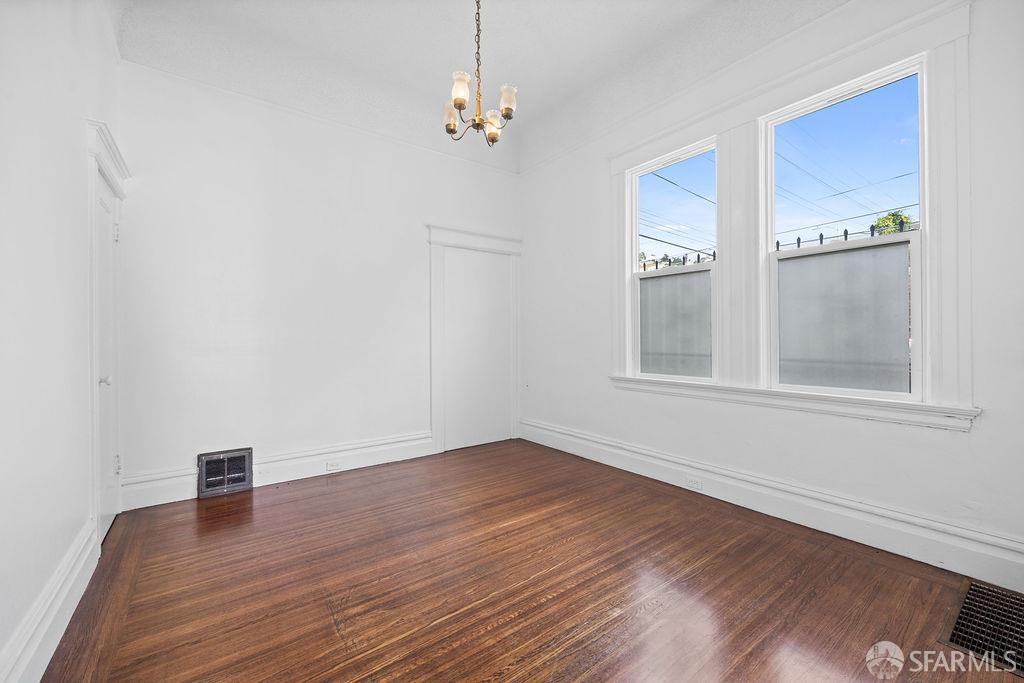 2401 23rd Street San Francisco, CA 94110 - Photo 6 of 76 wooden floor in an empty room with a window