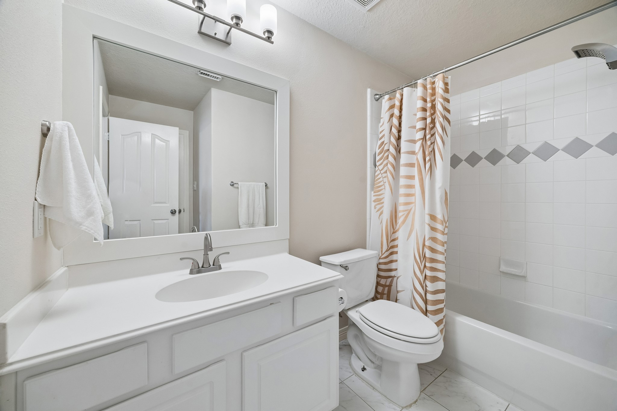 7618 North Linpar Court Houston, TX 77040 - Photo 22 of 34 The second floor full bath has a door leading into the second bedroom, plus a separate door access from the hallway.