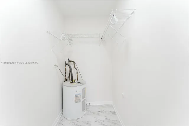 a view of a storage & utility room with a sink
