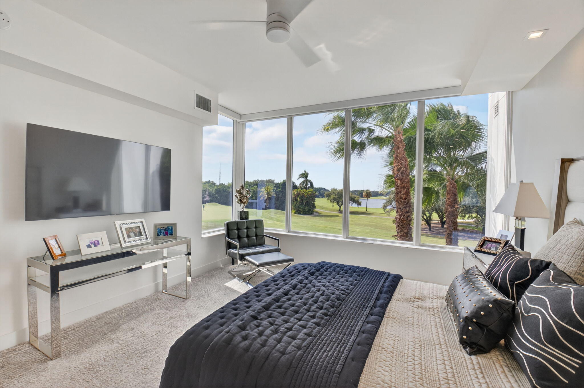 20155 Boca W Drive, Unit C205 Boca Raton, FL 33434 - Photo 19 of 122 a living room with furniture and a flat screen tv