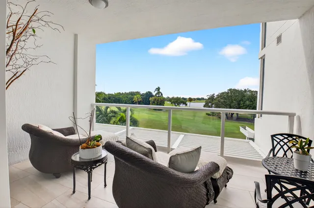 a view of a patio with a table and chairs