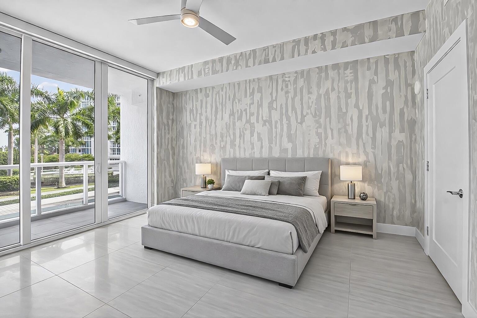 20155 Boca W Drive, Unit C205 Boca Raton, FL 33434 - Photo 33 of 122 a bedroom with a bed and a large window