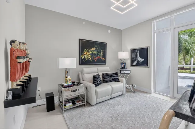 a living room with furniture a fireplace and walls