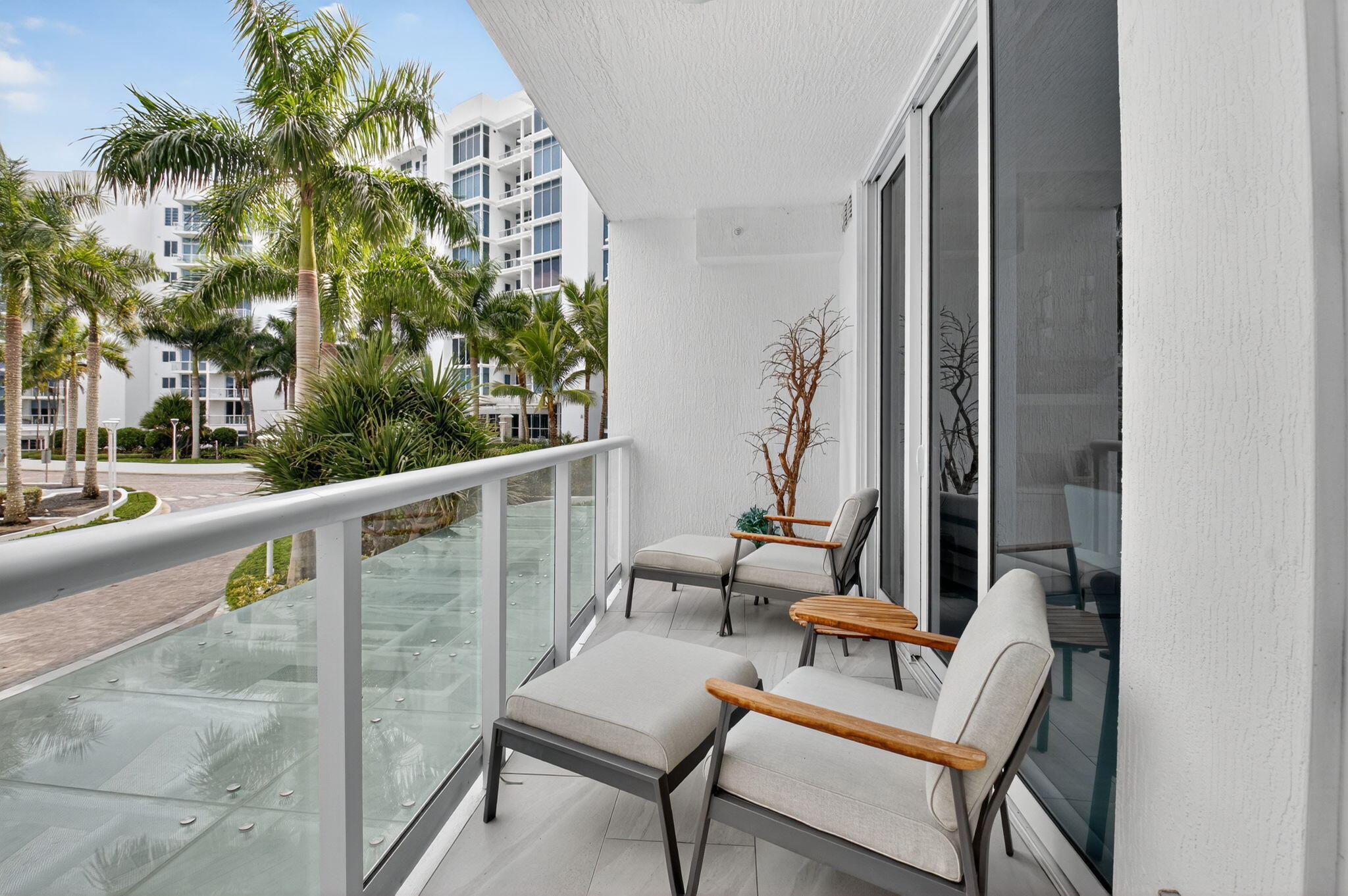 20155 Boca W Drive, Unit C205 Boca Raton, FL 33434 - Photo 41 of 122 a balcony with furniture and a potted plant