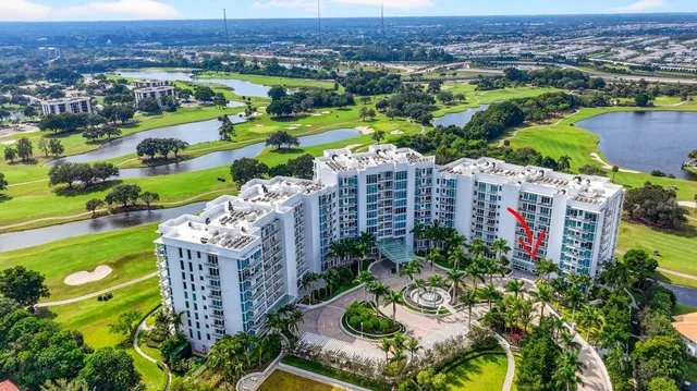 a living room with lots of furniture and a large window