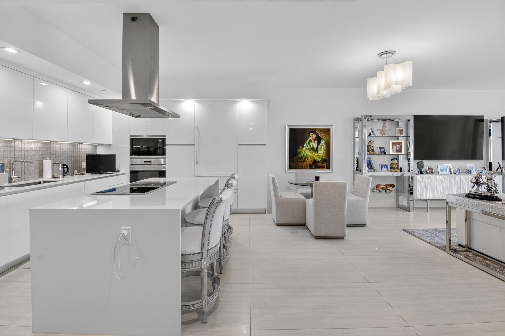 20155 Boca W Drive, Unit C205 Boca Raton, FL 33434 - Photo 5 of 122 a living room with furniture and a flat screen tv