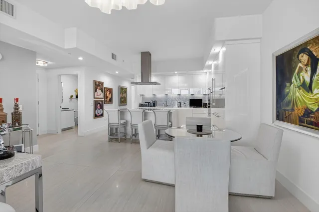 a kitchen with stainless steel appliances a refrigerator sink and microwave