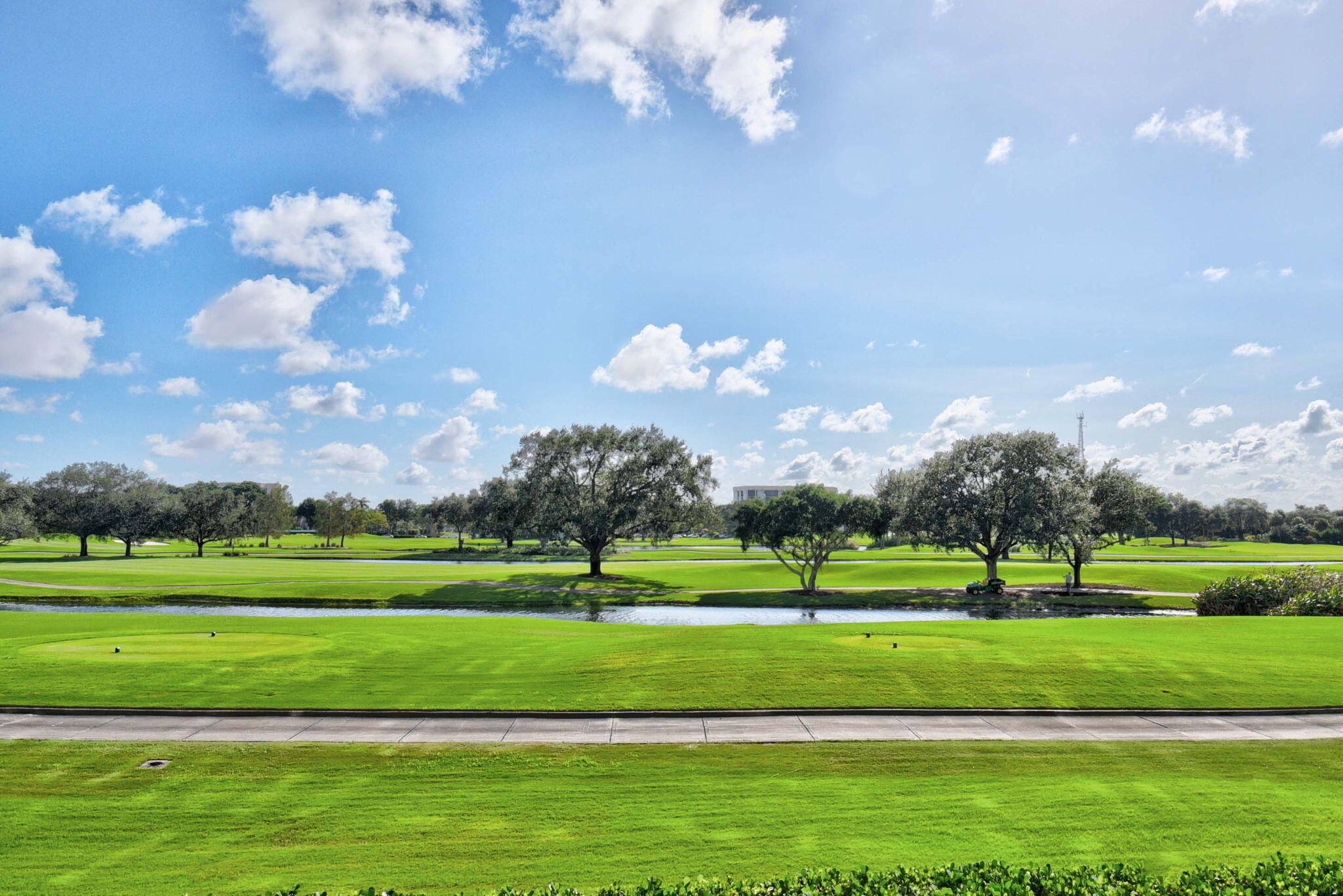 20155 Boca W Drive, Unit C205 Boca Raton, FL 33434 - Photo 78 of 122 a view of a golf course with a big yard