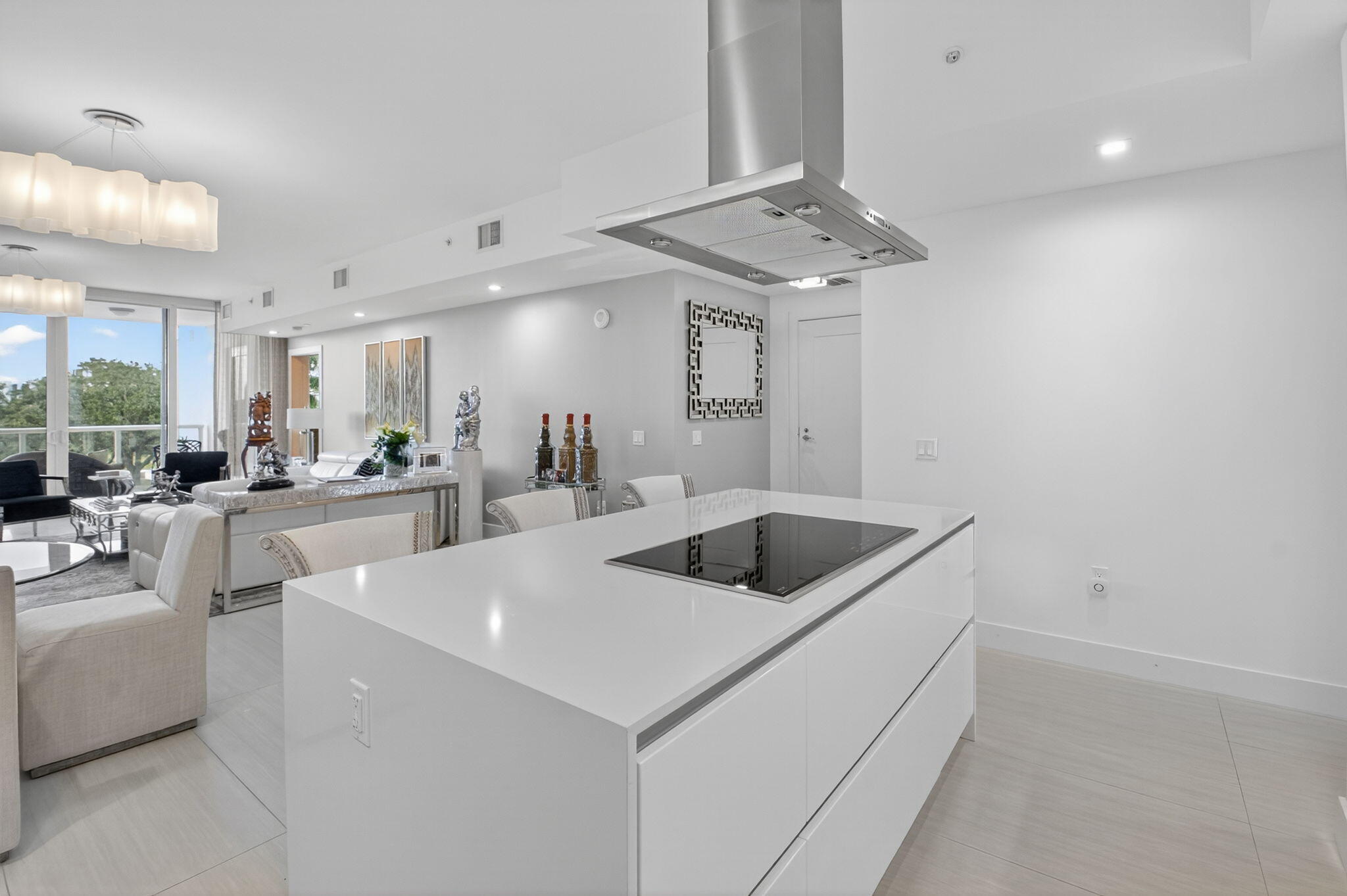 20155 Boca W Drive, Unit C205 Boca Raton, FL 33434 - Photo 10 of 122 a large white kitchen with a sink a refrigerator and a fireplace