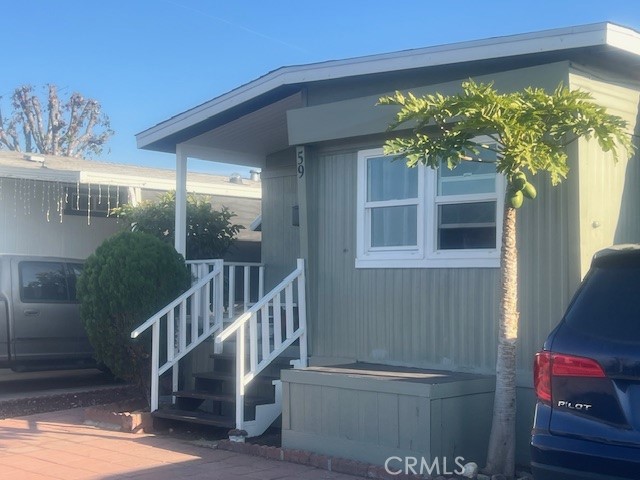 4101 North Paramount Boulevard Pico Rivera, CA 90660 - Photo 2 of 12 a view of a house with a tree