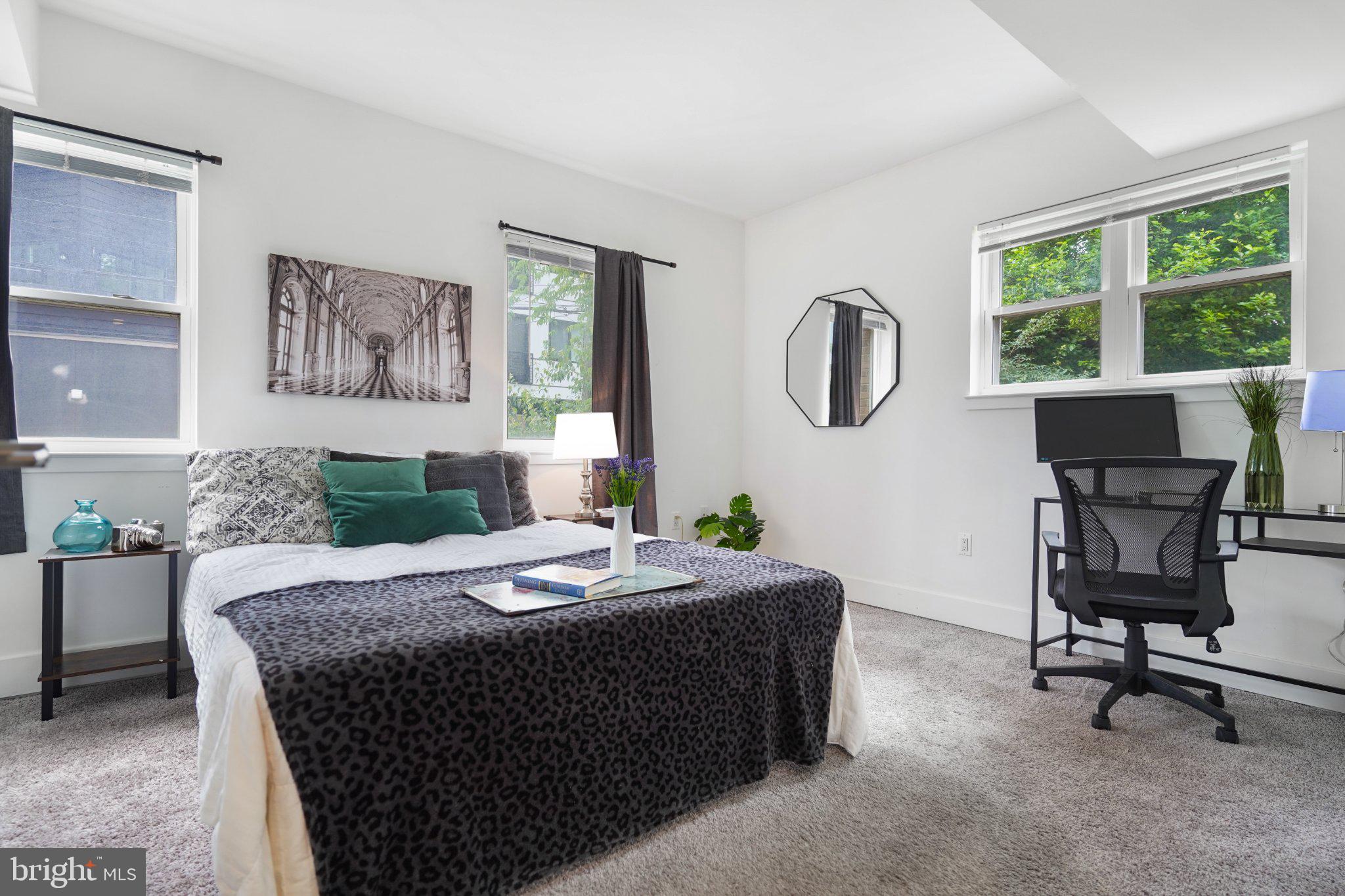 7723 Alaska Avenue Northwest, Unit 103 Washington, DC 20012 - Photo 2 of 12 Bright and inviting modern bedroom.
