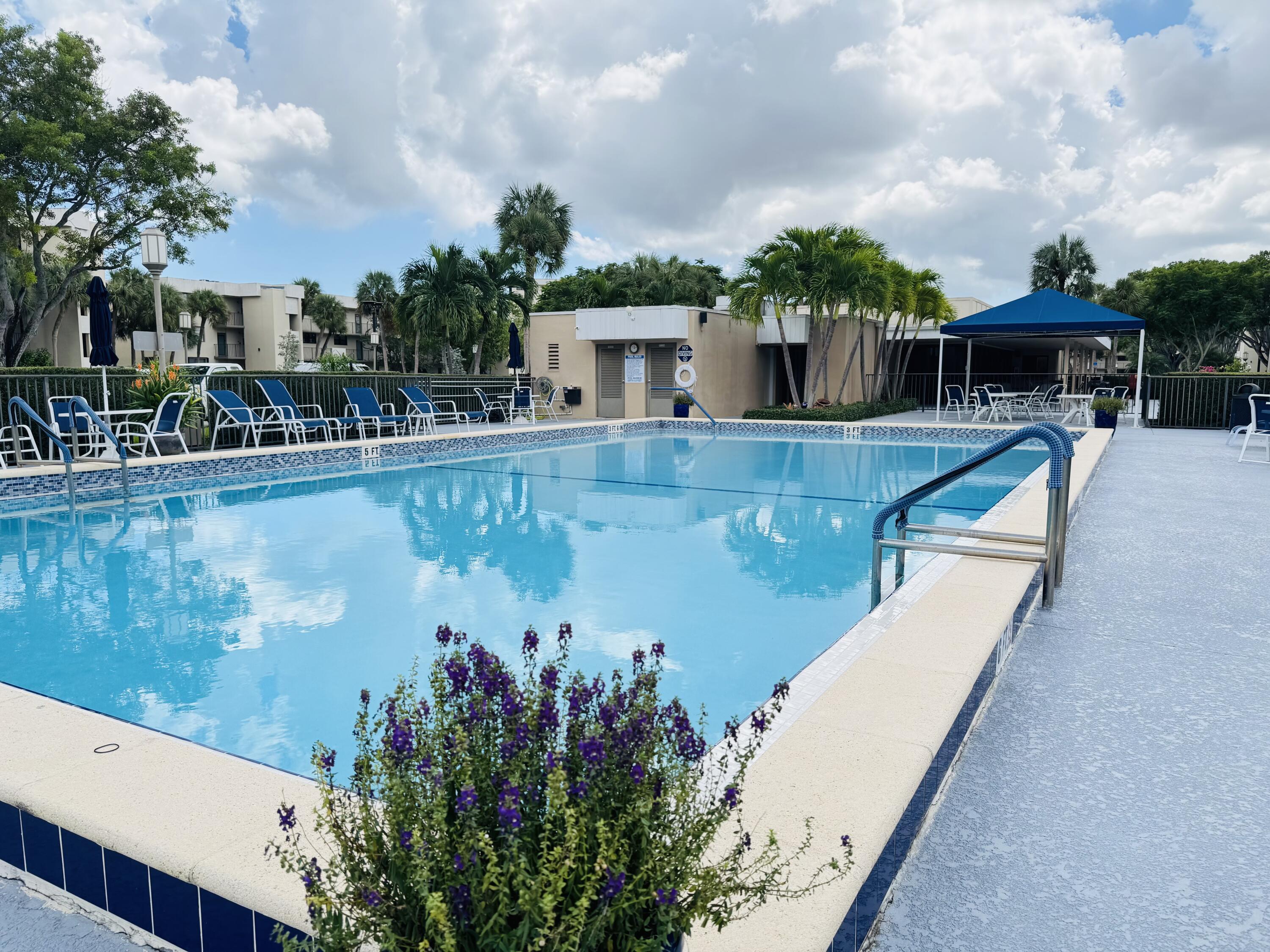 2430 DC Country Club Boulevard, Unit 4072 Deerfield Beach, FL 33442 - Photo 22 of 28 a view of a house with pool and sitting area