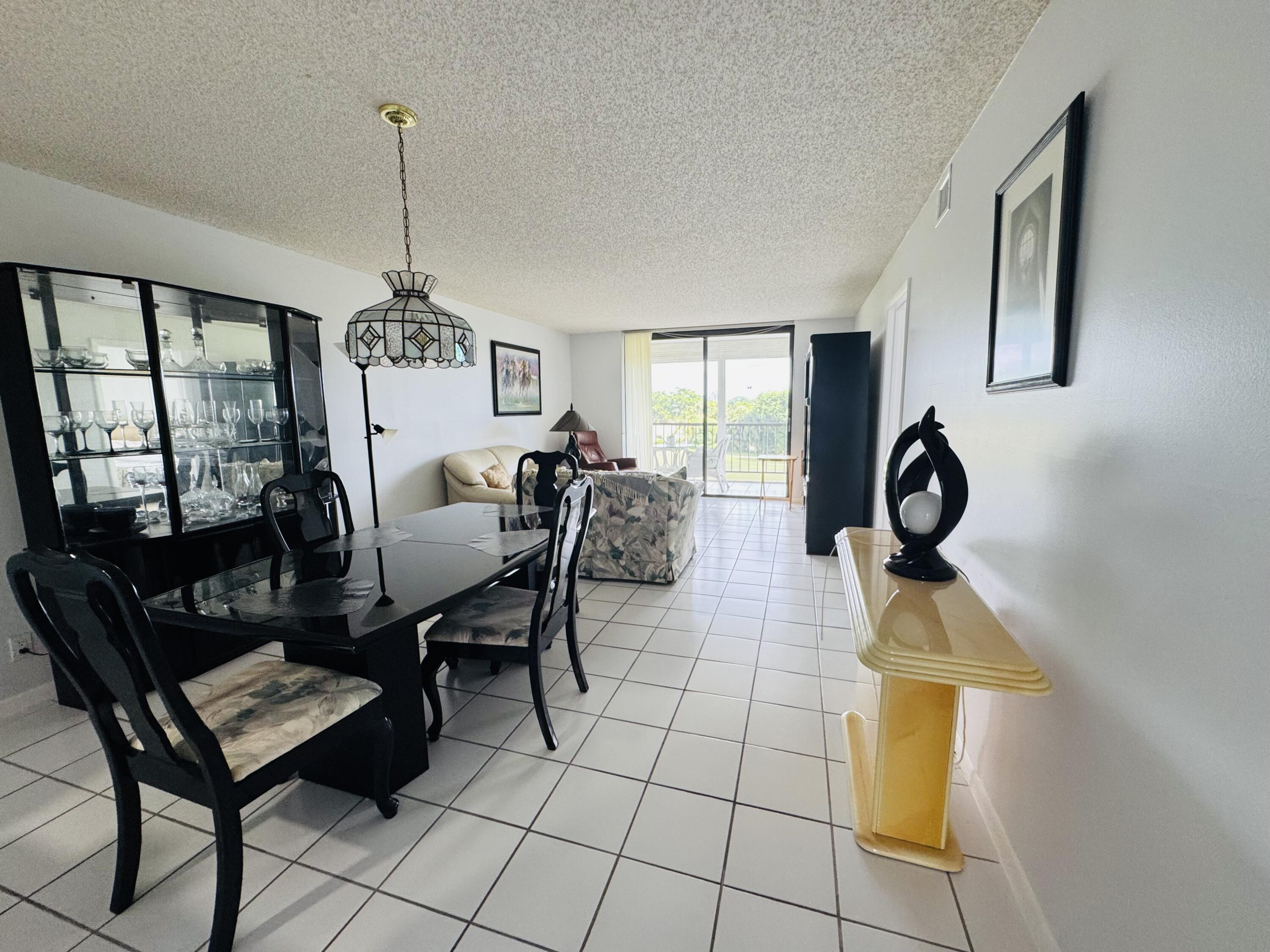 2430 DC Country Club Boulevard, Unit 4072 Deerfield Beach, FL 33442 - Photo 6 of 28 a view of a livingroom with furniture and window
