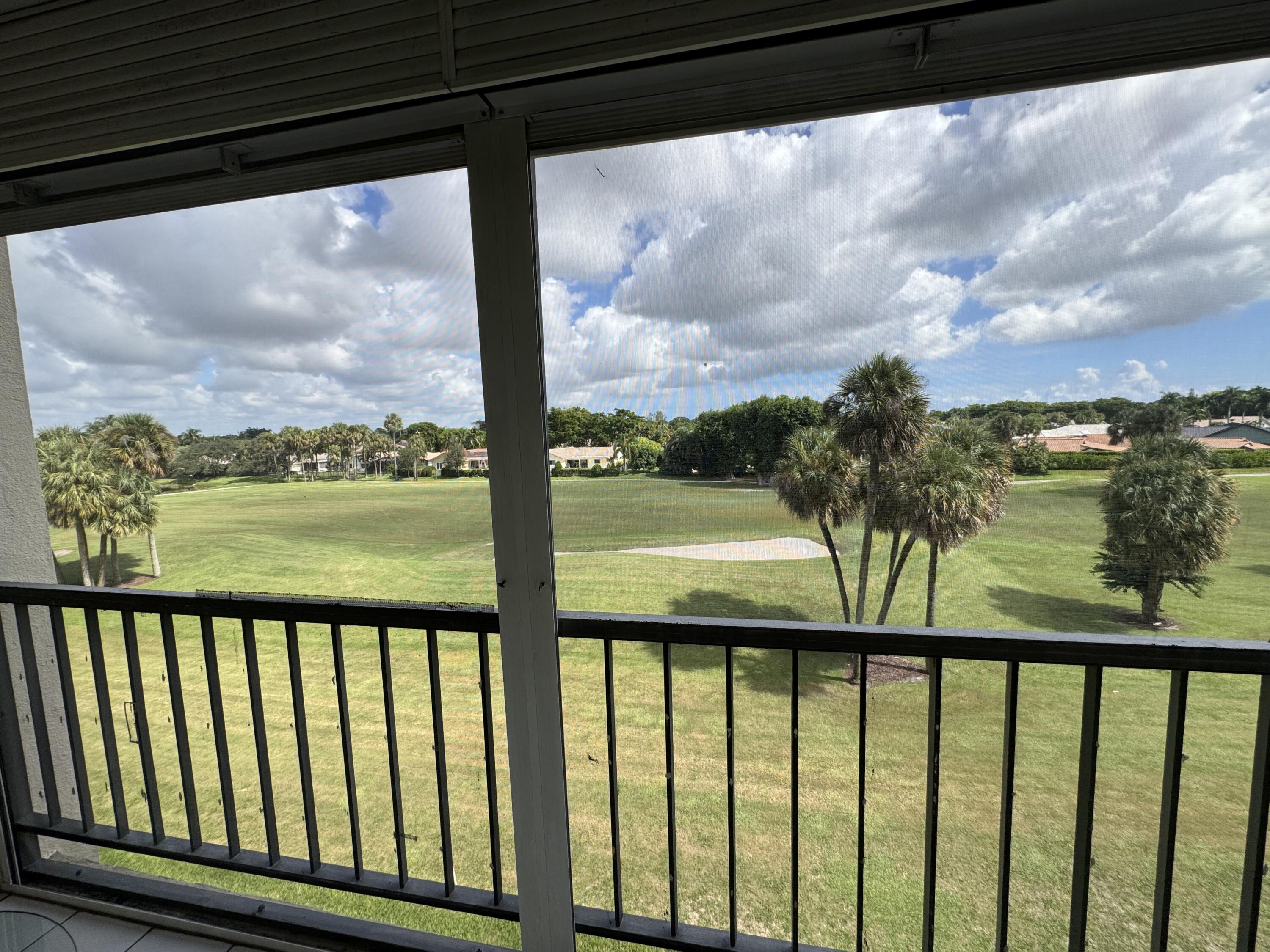 2430 DC Country Club Boulevard, Unit 4072 Deerfield Beach, FL 33442 - Photo 9 of 28 a view of balcony and lake from a balcony