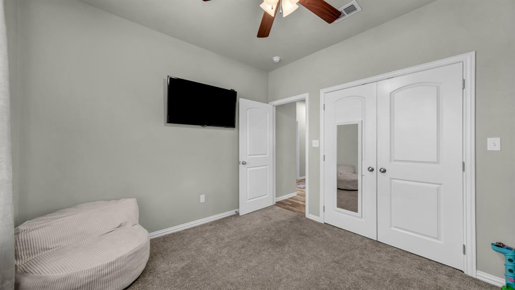 2023 Jo Jones Lane Springtown, TX 76082 - Photo 14 of 25 a living room with furniture and a flat screen tv