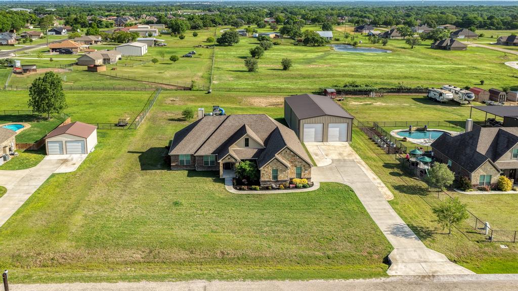 2023 Jo Jones Lane Springtown, TX 76082 - Photo 24 of 25 a view of a swimming pool and a yard