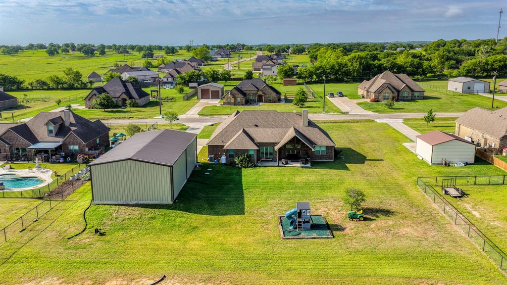 2023 Jo Jones Lane Springtown, TX 76082 - Photo 25 of 25 a aerial view of a house with swimming pool and yard