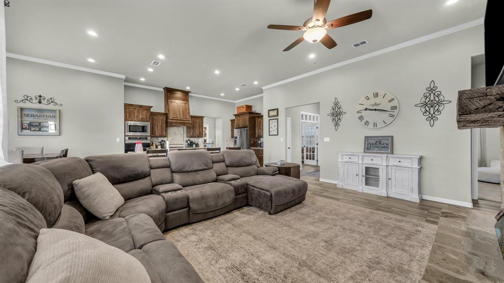 2023 Jo Jones Lane Springtown, TX 76082 - Photo 7 of 25 a living room with furniture and a flat screen tv