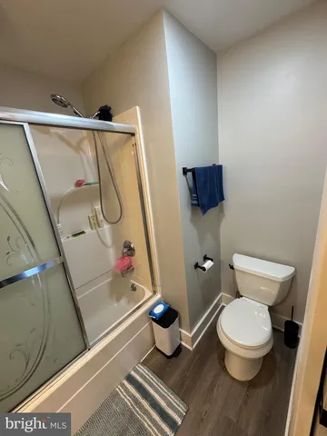 a bedroom with bed and window