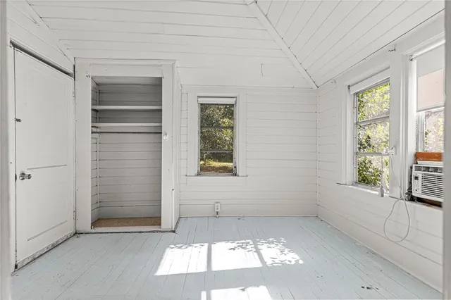 an empty room with windows