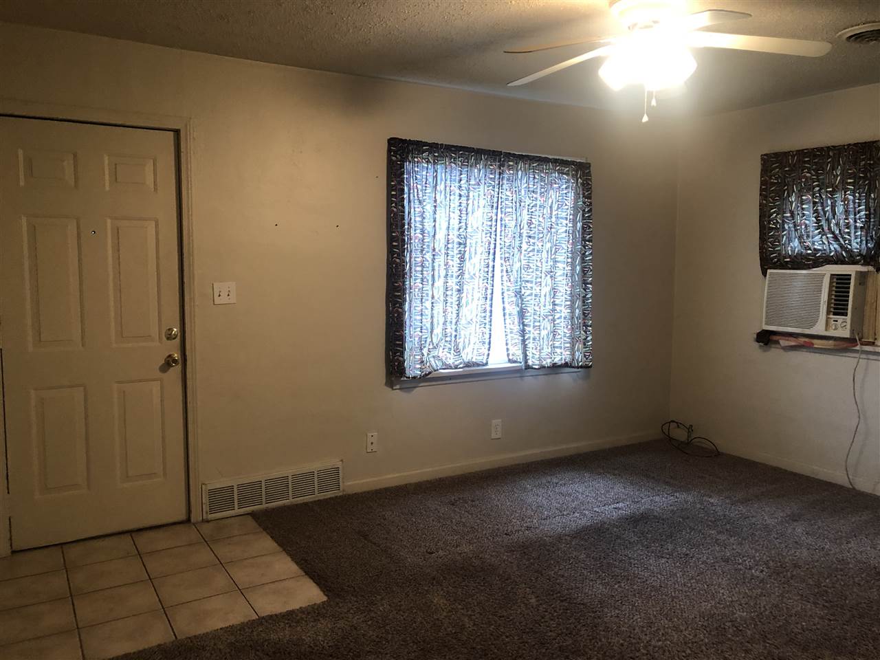 902 Windsor Road Loves Park, IL 61111 - Photo 8 of 19 an empty room with windows