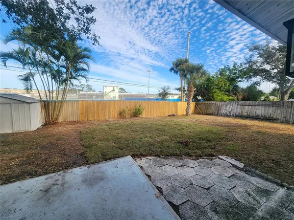 a backyard of a house with lots of green space