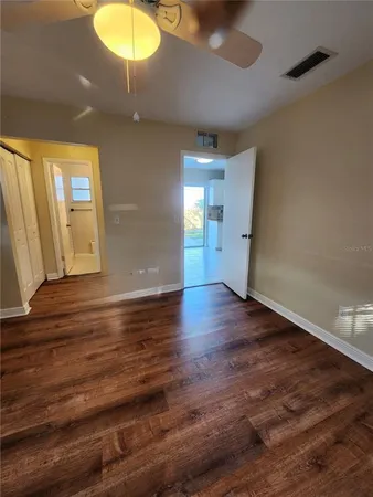 a view of a livingroom with wooden floor